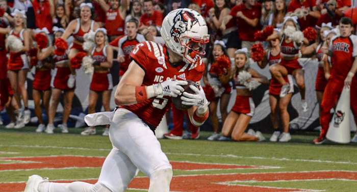 Scenes at an NC State college football game.